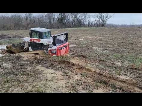 pull bobcat skid steer out of mud|bob cat kubota skid steer stuck.